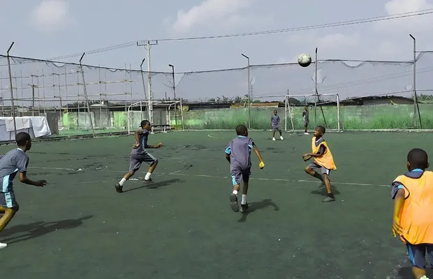 Acada Ace College students playing on the field